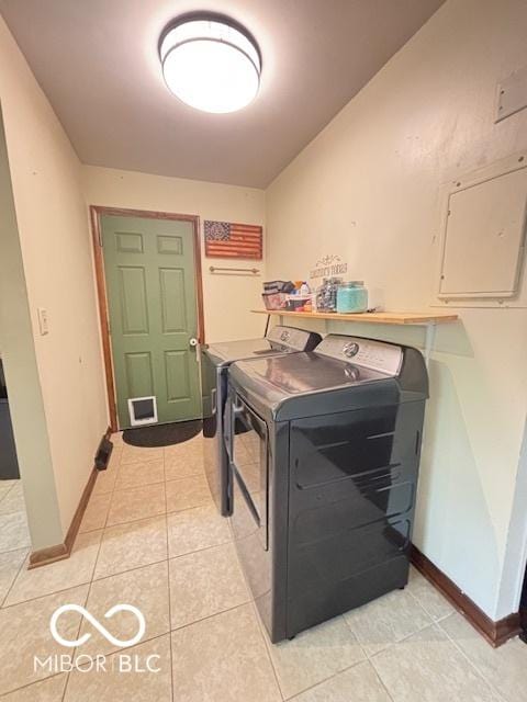 6546 Derbyshire Rd, Indianapolis, IN 46227 - washroom featuring washer and dryer, light tile patterned floors, and electric panel