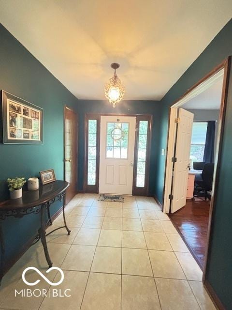 6546 Derbyshire Rd, Indianapolis, IN 46227 - foyer entrance featuring a chandelier, healthy amount of natural light, and light tile patterned floors