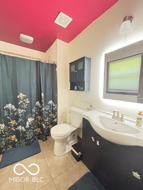 6546 Derbyshire Rd, Indianapolis, IN 46227 - full bathroom featuring tile patterned flooring, vanity, and curtained shower
