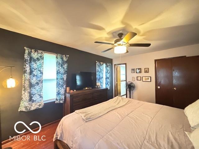 6546 Derbyshire Rd, Indianapolis, IN 46227 - bedroom featuring wood finished floors and a ceiling fan