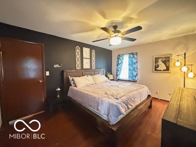6546 Derbyshire Rd, Indianapolis, IN 46227 - bedroom featuring dark wood finished floors and ceiling fan