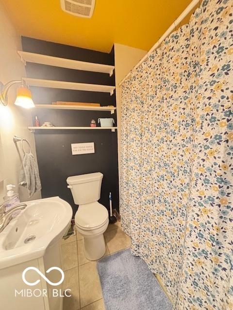 6546 Derbyshire Rd, Indianapolis, IN 46227 - full bathroom with tile patterned flooring, vanity, and curtained shower