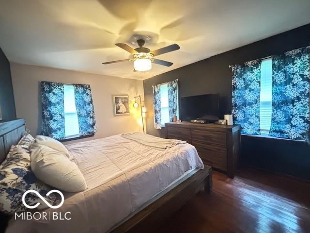 6546 Derbyshire Rd, Indianapolis, IN 46227 - bedroom featuring wood finished floors and a ceiling fan