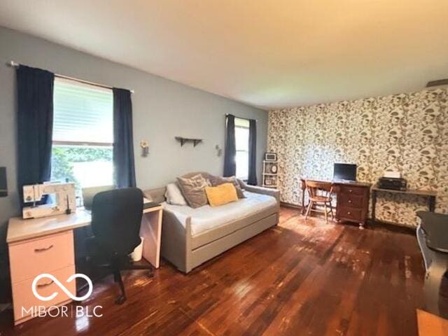 6546 Derbyshire Rd, Indianapolis, IN 46227 - home office with dark wood-style flooring and wallpapered walls