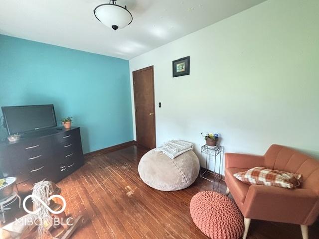 6546 Derbyshire Rd, Indianapolis, IN 46227 - sitting room featuring hardwood / wood-style floors and baseboards