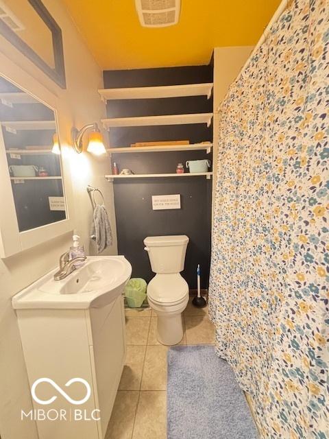 6546 Derbyshire Rd, Indianapolis, IN 46227 - bathroom with vanity, tile patterned flooring, and a shower with shower curtain