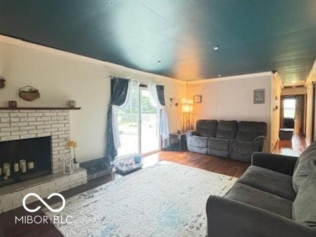 6546 Derbyshire Rd, Indianapolis, IN 46227 - living room with ornamental molding, wood finished floors, and a fireplace
