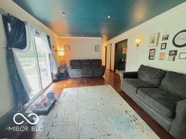 6546 Derbyshire Rd, Indianapolis, IN 46227 - living area featuring crown molding and wood finished floors