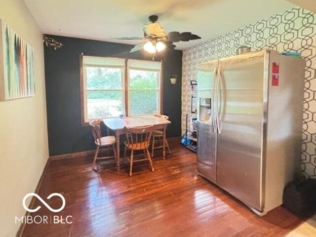 6546 Derbyshire Rd, Indianapolis, IN 46227 - dining space featuring wood finished floors, wallpapered walls, and ceiling fan