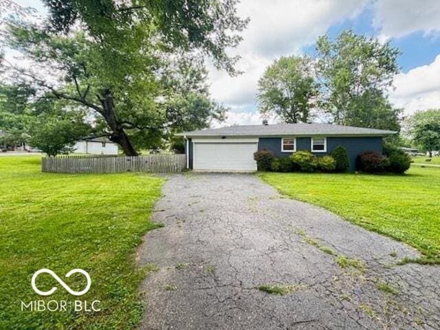 6546 Derbyshire Rd, Indianapolis, IN 46227 - view of front facade with a garage and driveway