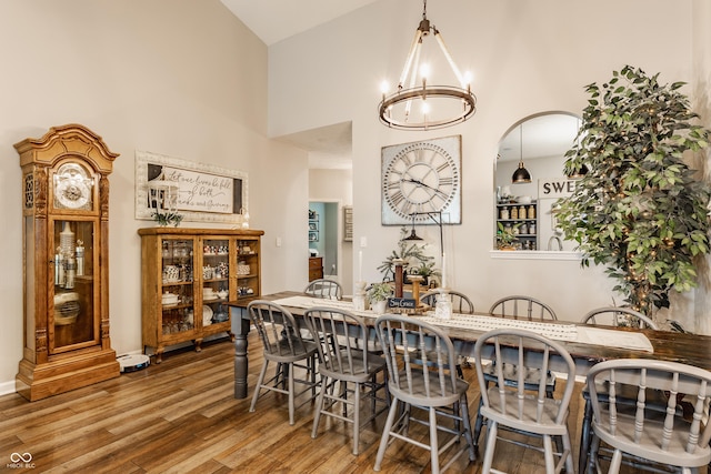 10585 Windward Dr, Indianapolis, IN 46234 - dining room with wood finished floors, high vaulted ceiling, and a chandelier