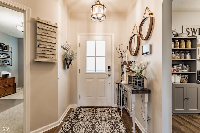 10585 Windward Dr, Indianapolis, IN 46234 - doorway to outside with baseboards and a chandelier