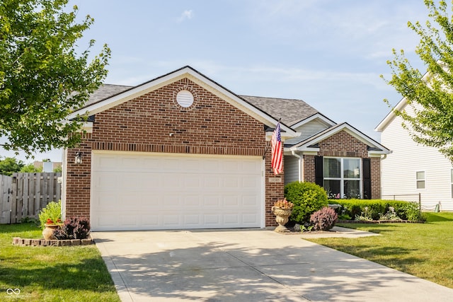 10585 Windward Dr, Indianapolis, IN 46234 - view of front facade with brick siding, concrete driveway, an attached garage, and a shingled roof