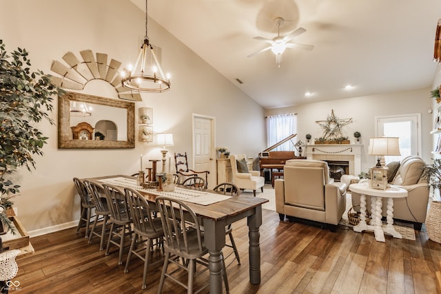 10585 Windward Dr, Indianapolis, IN 46234 - dining room with hardwood / wood-style flooring, a ceiling fan, a fireplace, high vaulted ceiling, and recessed lighting