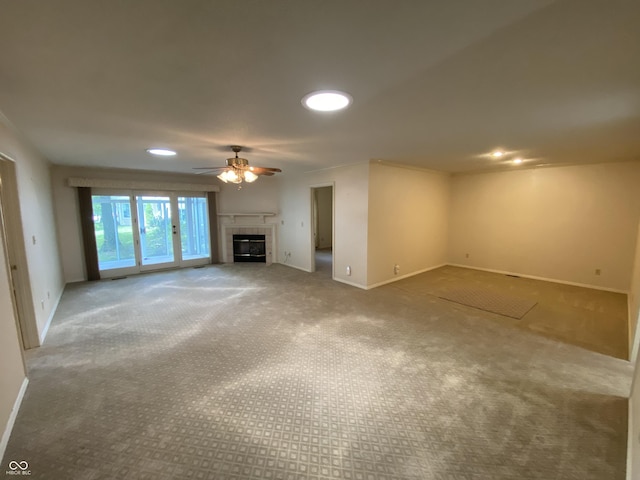3910 S Baytree Ln, Bloomington, IN 47401 - unfurnished living room with a tile fireplace, ceiling fan, carpet floors, and recessed lighting