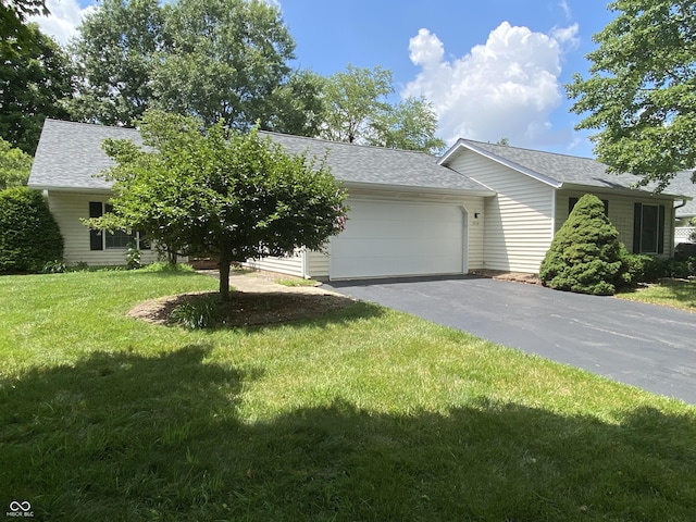 3910 S Baytree Ln, Bloomington, IN 47401 - view of front of home featuring driveway, an attached garage, a front yard, and a shingled roof