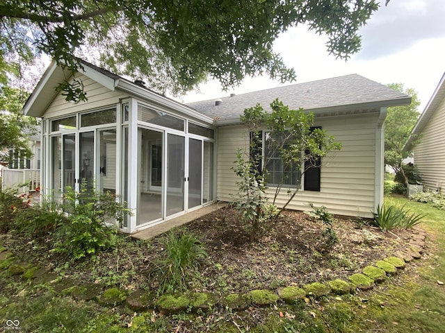3910 S Baytree Ln, Bloomington, IN 47401 - back of house with a sunroom and a shingled roof