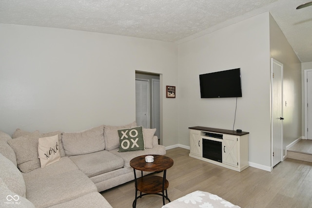 5936 Beau Jardin Dr, Indianapolis, IN 46237 - living room featuring light wood-style floors and a textured ceiling