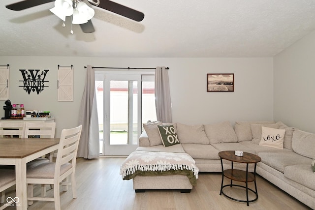 5936 Beau Jardin Dr, Indianapolis, IN 46237 - living room with a ceiling fan, wood finished floors, and a textured ceiling