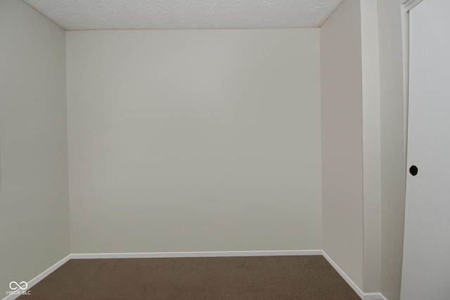 5936 Beau Jardin Dr, Indianapolis, IN 46237 - spare room featuring dark colored carpet and a textured ceiling