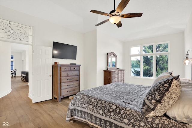 11137 Peppermill Ln, Fishers, IN 46037 - bedroom with light wood-style floors, vaulted ceiling, and a ceiling fan
