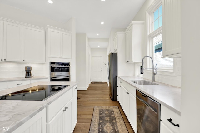 11137 Peppermill Ln, Fishers, IN 46037 - kitchen featuring appliances with stainless steel finishes, healthy amount of natural light, white cabinetry, and recessed lighting