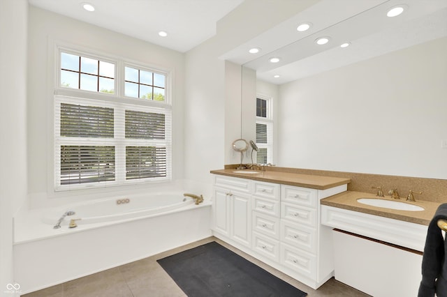 11137 Peppermill Ln, Fishers, IN 46037 - bathroom featuring double vanity, recessed lighting, a garden tub, and tile patterned floors