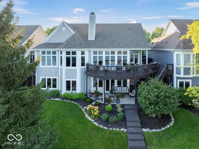 11137 Peppermill Ln, Fishers, IN 46037 - back of property with a chimney, a lawn, a shingled roof, and a patio area