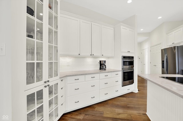 11137 Peppermill Ln, Fishers, IN 46037 - kitchen with stainless steel appliances, light stone counters, white cabinets, dark wood-style floors, and recessed lighting