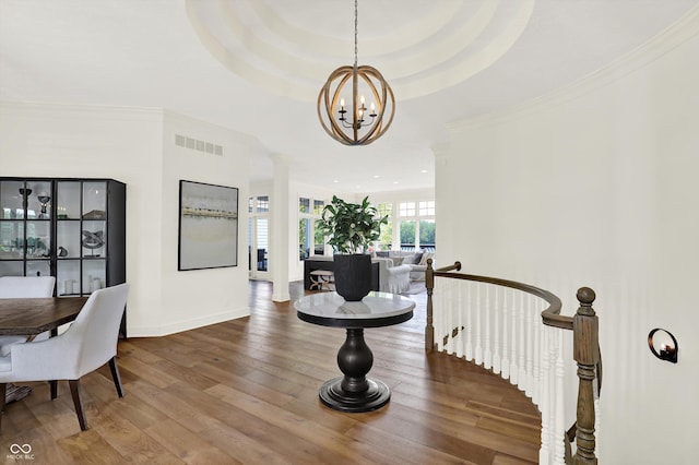 11137 Peppermill Ln, Fishers, IN 46037 - dining space featuring a chandelier, wood finished floors, and crown molding