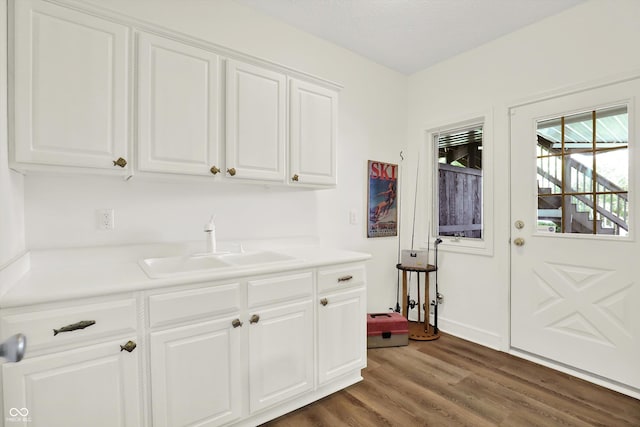 11137 Peppermill Ln, Fishers, IN 46037 - kitchen featuring dark wood-style floors, white cabinets, and light countertops