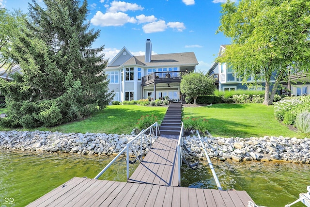 11137 Peppermill Ln, Fishers, IN 46037 - rear view of house featuring a water view, a chimney, a yard, stairs, and a balcony