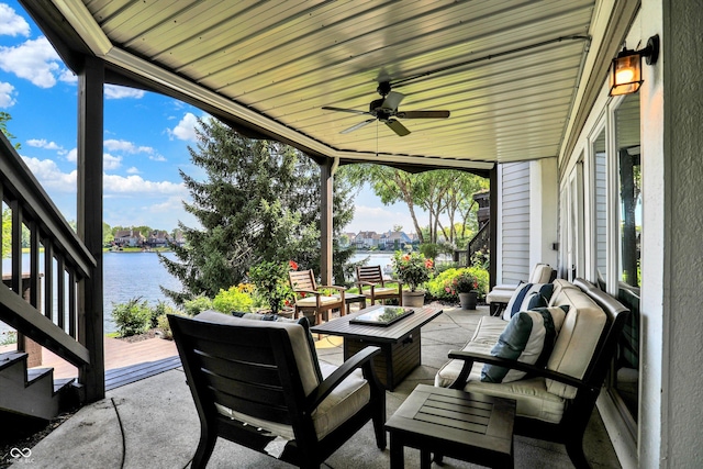 11137 Peppermill Ln, Fishers, IN 46037 - view of patio with a water view, a ceiling fan, and an outdoor living space with a fire pit