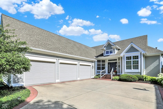 11137 Peppermill Ln, Fishers, IN 46037 - view of front of home featuring concrete driveway, roof with shingles, and an attached garage