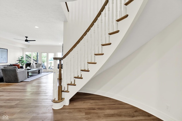 11137 Peppermill Ln, Fishers, IN 46037 - staircase featuring wood finished floors, a ceiling fan, and recessed lighting