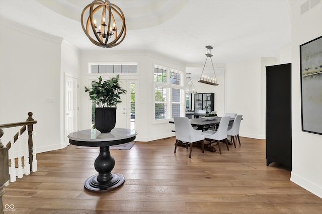 11137 Peppermill Ln, Fishers, IN 46037 - dining area with a chandelier, hardwood / wood-style floors, and crown molding