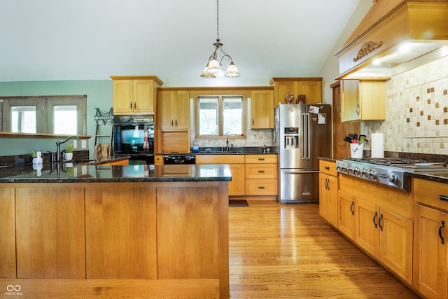 20136 Stone Church Rd, Laurel, IN 47024 - kitchen featuring black appliances, premium range hood, vaulted ceiling, backsplash, and pendant lighting