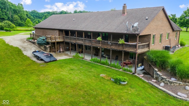 20136 Stone Church Rd, Laurel, IN 47024 - back of property with a deck, a lawn, a patio, and brick siding