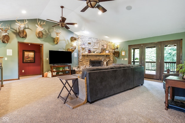 20136 Stone Church Rd, Laurel, IN 47024 - carpeted living room featuring a ceiling fan, vaulted ceiling, and a stone fireplace