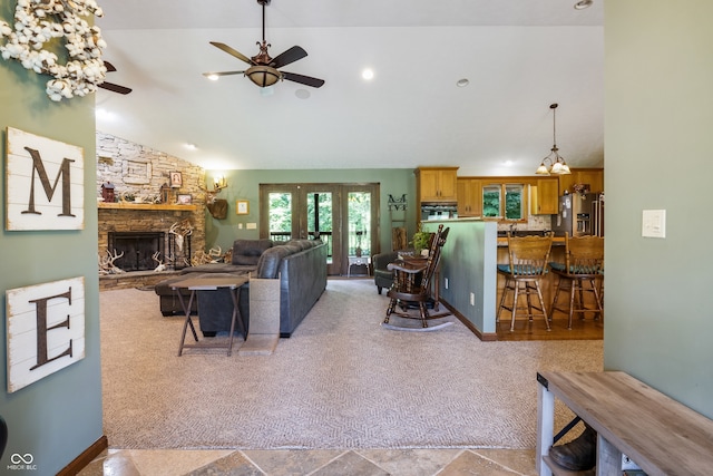 20136 Stone Church Rd, Laurel, IN 47024 - living area with a ceiling fan, light carpet, a fireplace, french doors, and high vaulted ceiling