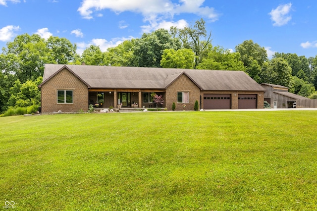 20136 Stone Church Rd, Laurel, IN 47024 - view of front of property featuring an attached garage, a front lawn, brick siding, and a porch