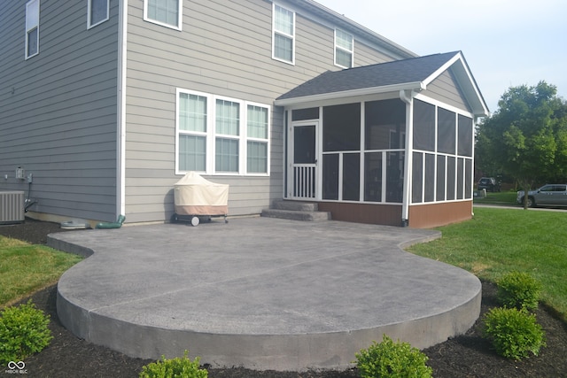 10166 Ranford Blvd, Fishers, IN 46040 - rear view of house with a sunroom, a patio, and a lawn