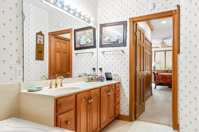 2320 Whispering Way, Indianapolis, IN 46239 - bathroom featuring wallpapered walls, vanity, a ceiling fan, and ensuite bath
