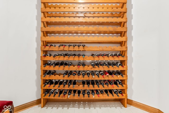 2320 Whispering Way, Indianapolis, IN 46239 - wine room with baseboards and light tile patterned flooring