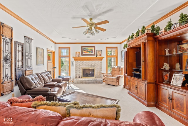 2320 Whispering Way, Indianapolis, IN 46239 - living room with light carpet, ceiling fan, a fireplace, and ornamental molding