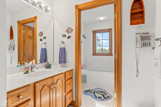 2320 Whispering Way, Indianapolis, IN 46239 - full bathroom featuring vanity, a relaxing tiled tub, and tile patterned flooring
