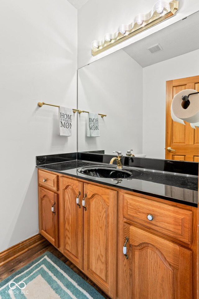 2320 Whispering Way, Indianapolis, IN 46239 - bathroom with vanity and wood finished floors