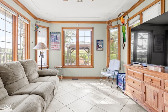 2320 Whispering Way, Indianapolis, IN 46239 - living room featuring light tile patterned flooring, healthy amount of natural light, ceiling fan, and crown molding