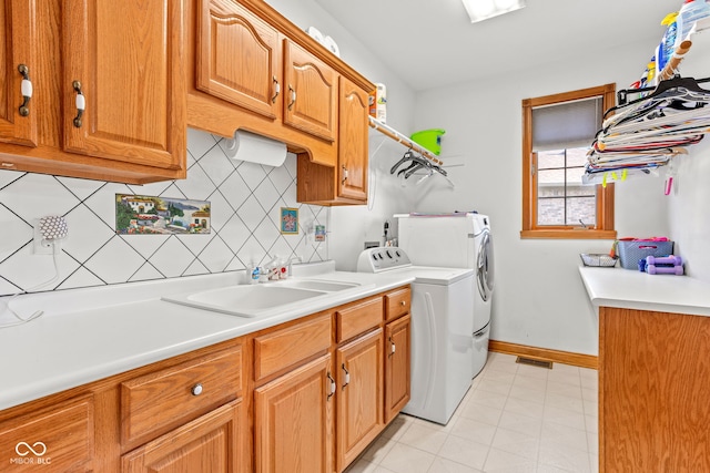 2320 Whispering Way, Indianapolis, IN 46239 - laundry area with cabinet space and separate washer and dryer