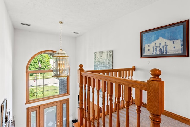 2320 Whispering Way, Indianapolis, IN 46239 - entryway with a textured ceiling and carpet flooring